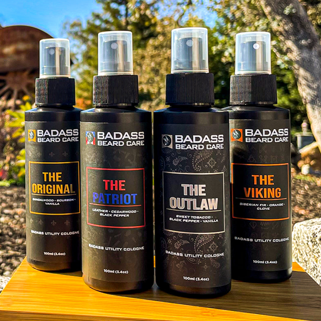 Four Utility Cologne bottles displayed outdoors