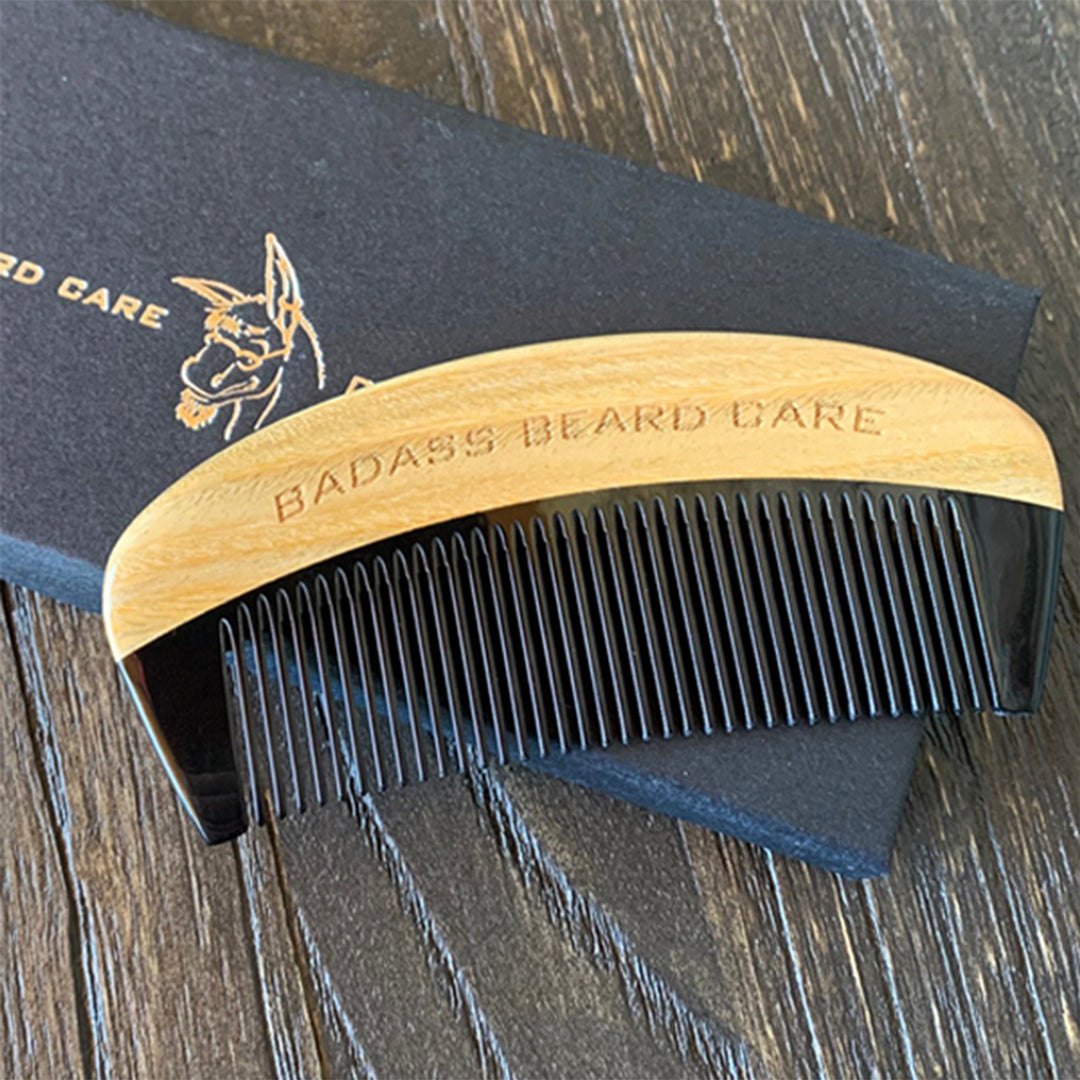 Fine Tooth Ox Horn Comb resting on its black box
