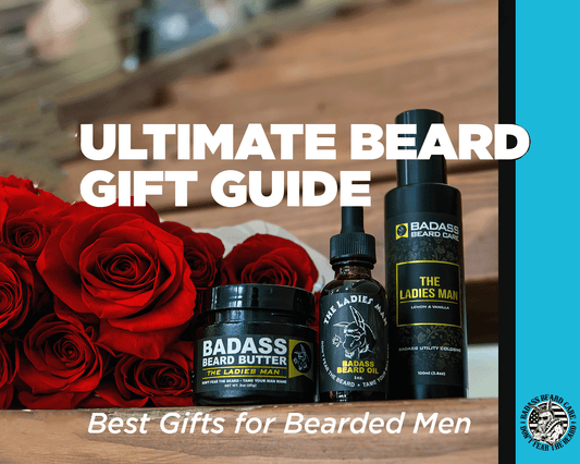 Badass beard butter, oil, and cologne on top of a wooden table with a bunch of roses alongside